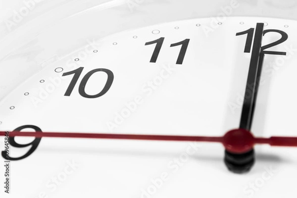Fototapeta Closeup of hands on clock face.sensitive focus