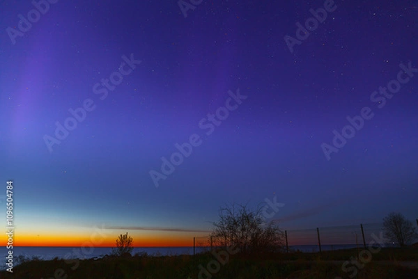 Obraz Night clear sky view with starts and late sunset on horizon, sea shore