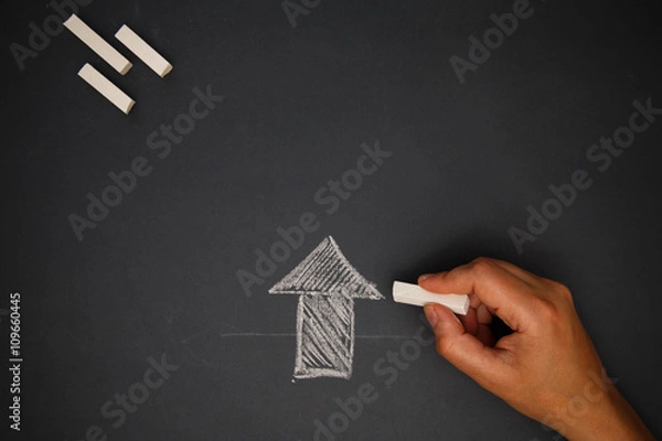 Obraz Hand with chalk on board