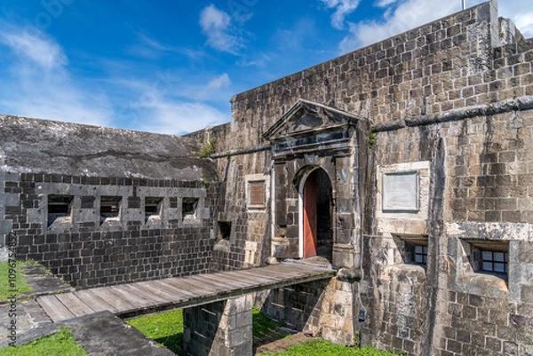 Fototapeta Panoramic view of caponier, citadel gate at Brimstone Hill Fort St Kitts and Nevis with cloudy blue sky