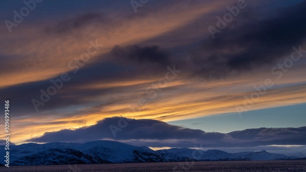 Obraz sunset over the snowy mountains