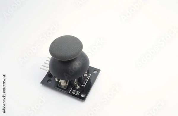 Fototapeta A joystick module with its rubber pads on a white background. Used for electronics and robotics enthusiasts.