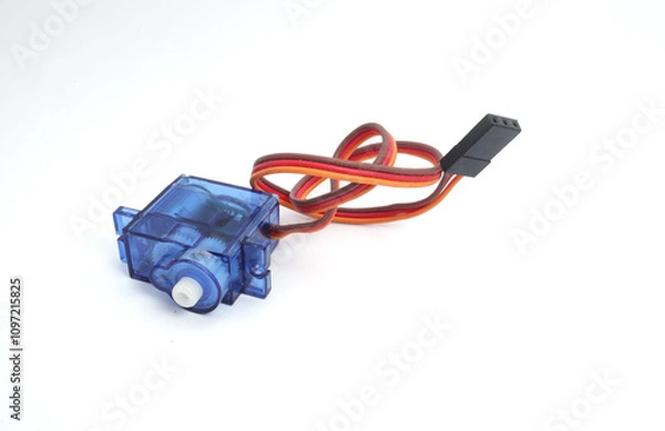 Fototapeta A blue plastic micro servo on a white background. Used by electronics, mechatronics, robotics, and remote control hobbyists.