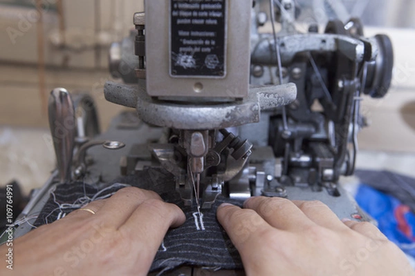 Fototapeta 25 September 2012 at a tailor in Barcelona, Spain. Production process of suit tailoring. Sewing of parts of a tailored jacket