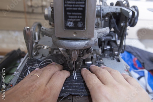 Fototapeta 25 September 2012 at a tailor in Barcelona, Spain. Production process of suit tailoring. Sewing of parts of a tailored jacket