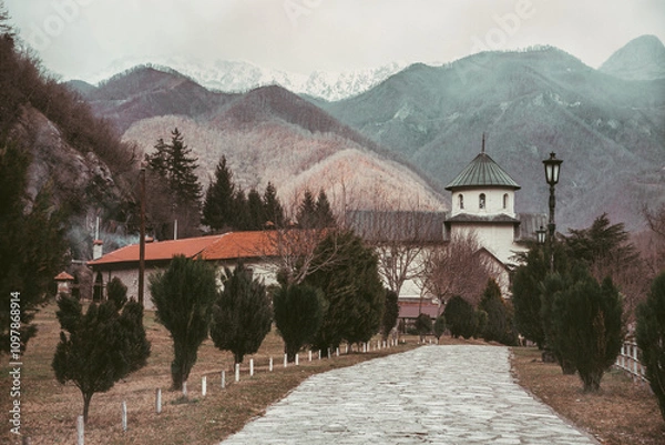 Obraz Beautiful view of the monastery and the mountains. A gloomy winter day in the Balkans