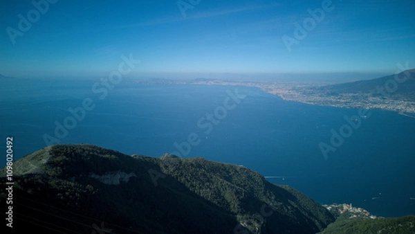 Fototapeta From the top of Monte Faito, in southern Italy, it is possible to admire a fantastic landscape in which mountain and coast merge: in the background Vesuvius, a volcano in southern Italy