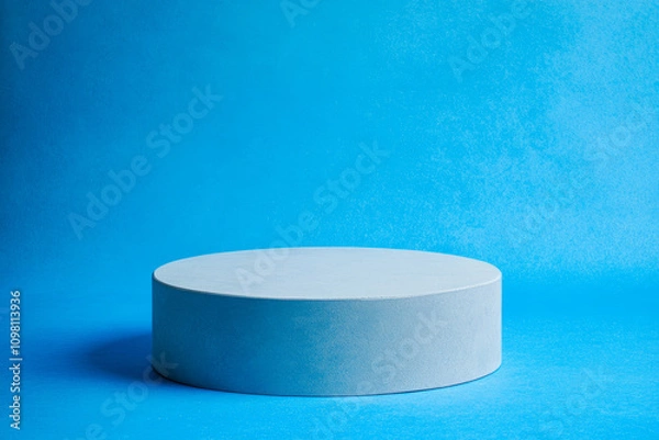 Obraz White rounded podium on a bright blue background. Minimalistic photo style.