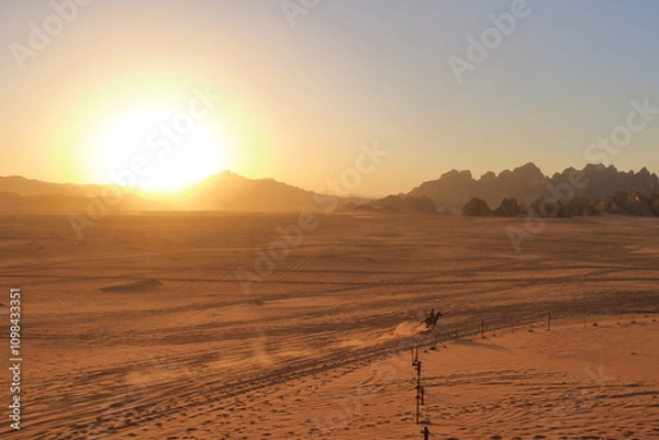 Obraz Wadi Rum, Jordan - May 15 2024: people enjoy the Sunset in the desert