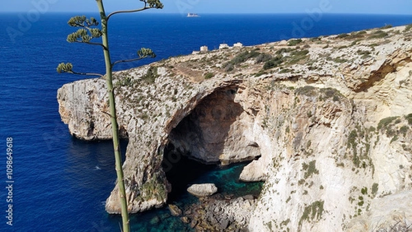 Obraz Cavern in the cliff called Blue Grotto. Delimara peninsula, near the village of Wied iż-Żurrieq, southeast coast of Malta, Europe.
