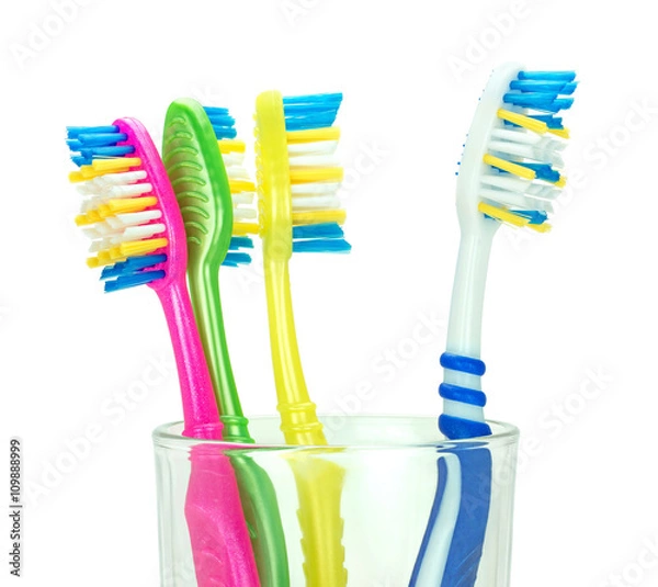 Obraz Четыре зубные щетки в стеклянном стакане
