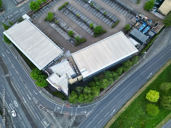 Fototapeta Aerial View of Buildings at Greater Manchester Central City, Northwest of England, United Kingdom. Aerial View Footage Was Captured with Drone's Camera on May 4th, 2024 During Sunset Time.