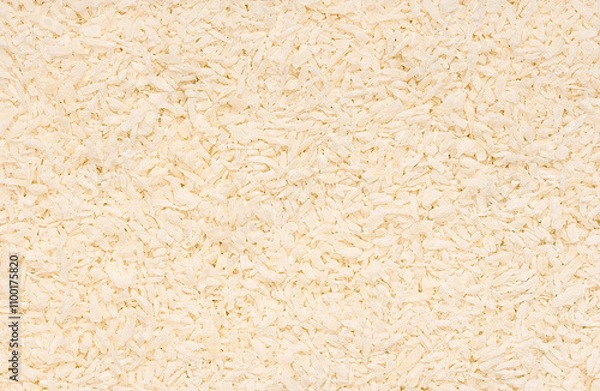 Fototapeta Macro photography of desiccated coconut, shredded, raw; ketogenic diet, healthy vegan food; natural ingredient; dry coconut flakes