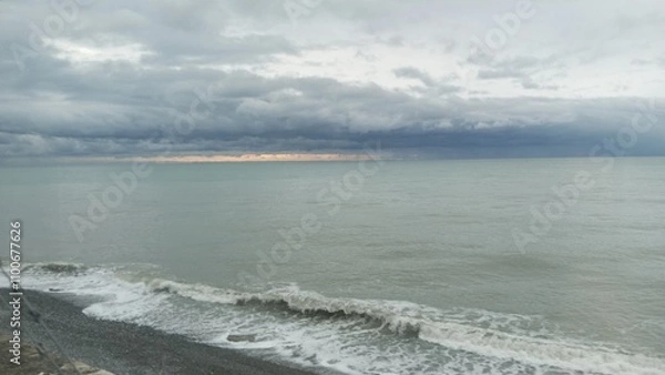 Fototapeta The sea in bad weather. Sea shore, surf, pebbles.