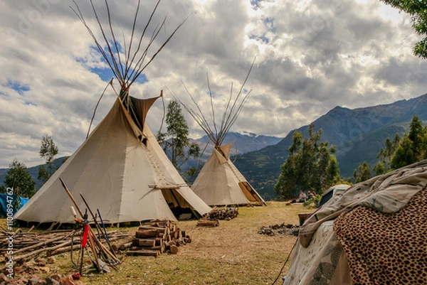 Fototapeta Community of people in a camp in the mountains of cusco peru on a vision quest with teepees 