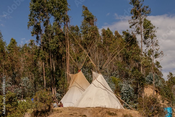 Fototapeta Community of people in a camp in the mountains of cusco peru on a vision quest with teepees 