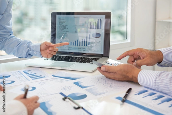 Fototapeta accountant or business people are calculate valuation and appraisal value of property business company and stock.