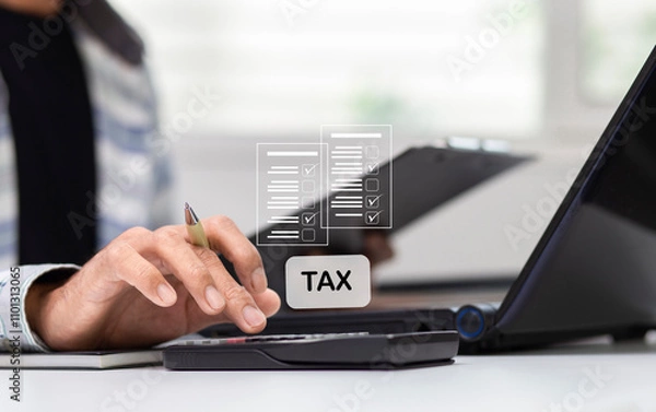 Fototapeta Businessman using calculator and calculate tax  at workplace