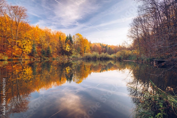 Obraz Autumn scene with lake and trees, Autumn Reflection, Bakony Forest and Mountain, Pisztrangos Lake, Hungary. Long exposure shot.