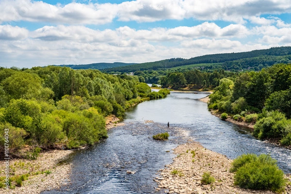Obraz View from Hexham Bridge of Man Fishing in the River Tyne near Hexham, UK