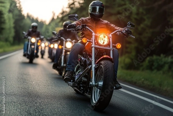 Fototapeta Group of motorcyclists riding together on a road, possibly on a tour or adventure