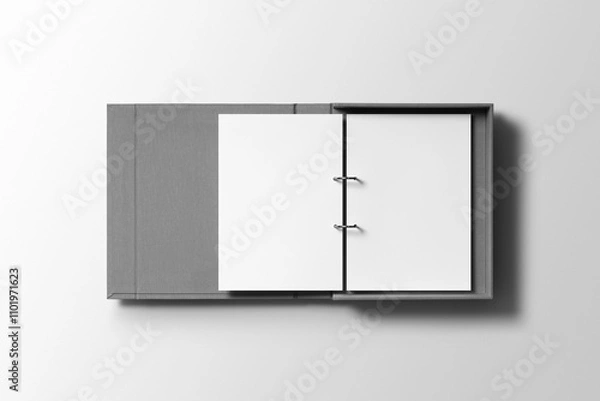 Fototapeta An open binder reveals a neatly secured A4 letterhead mockup, showcasing a polished design with a professional layout and metallic ring clips.