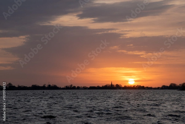 Obraz Sunset at Langweerder Wielen (Frisian: Langwarder Wielen), Frisian Lake in the Netherlands. View of the church tower of Langweer. 