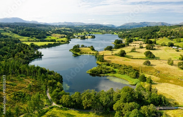 Fototapeta Esthwaite Lake, Lake District National Park, Cumbria. View NW to L-R Wetherlam, Bowfell, Langdale Pikes, Dunmail Raise, Helvellyn, Fairfield. Summer