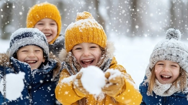 Fototapeta A group of four kids enjoying a snowy day, laughing and throwing snowballs, while bundled up in colorful winter attire, capturing a moment of pure joy and excitement.