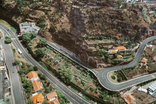 Fototapeta View from above of a highway and tiled roofs in Funchal
