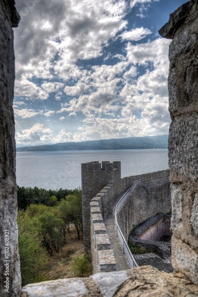Obraz Castle walls, view of Samuil's Fortress, Unesco World Heritage Site, on Lake Ohrid, Ohrid town. View from watchtower of famous old fortress ruins of king Samuel. Clouds over the Lake and blue water.