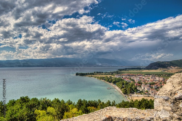 Obraz Castle walls, view of Samuil's Fortress, Unesco World Heritage Site, on Lake Ohrid, Ohrid town. View from watchtower of famous old fortress ruins of king Samuel. Clouds over the Lake and blue water.