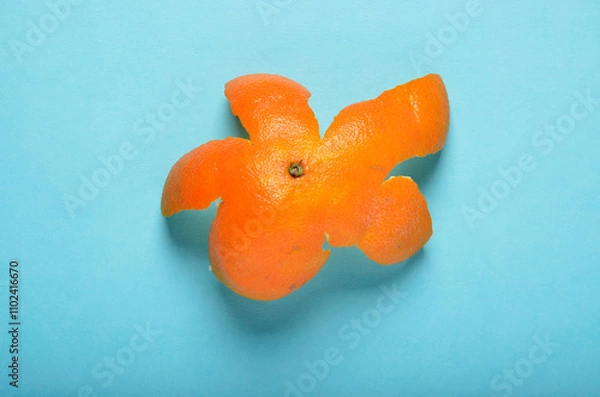 Obraz Top orange peel on blue background
