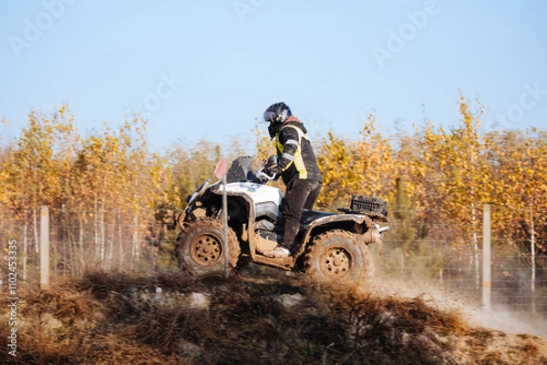 Fototapeta Quad bike. Cross-country quad bike, extreme sports. ATV Bike speed. Man riding ATV vehicle on off road track. People aoutdoor sport activities theme.