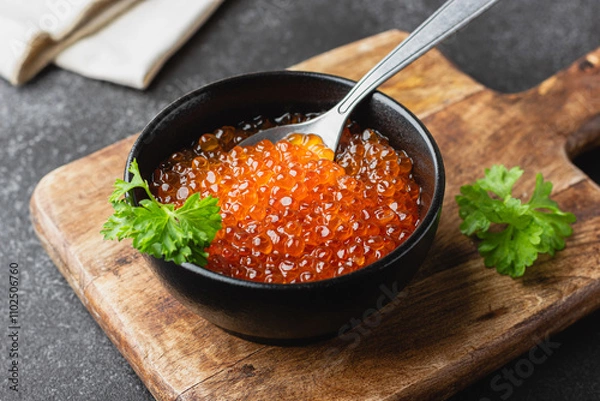 Obraz Red salmon caviar with parsley in a bowl