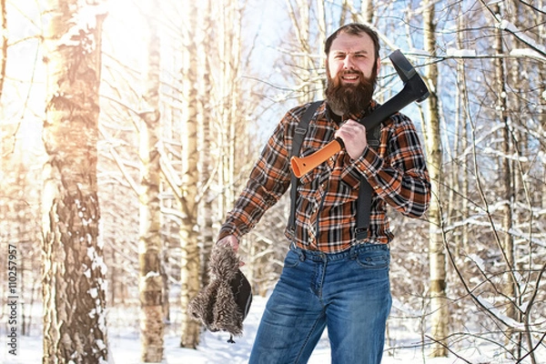 Fototapeta birch winter forest man with axe