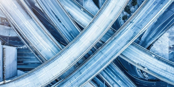 Fototapeta Aerial photograph of modern urban highway with intricate overpasses and lanes, showcasing complexity of city infrastructure and transportation