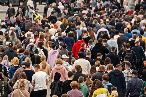 Fototapeta a background of unrecognizable people. Pandemonium in the metropolis. Overpopulation of the modern city. lots of people outside in the open air. A lot of urban residents have a rear view.