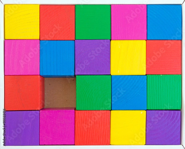 Fototapeta Children's toy - multicolored cubes in box (one cube is not enou