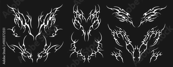 Fototapeta Neo tribal tattoo set. Neotribal gothic butterfly with wings, flame, heart, womb, symmetrical abstract dividers. Cyber sigilism y2k design elements. Celtic gothic body ornaments, emo stylized stickers