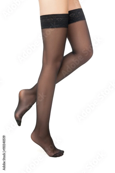 Fototapeta Side view of woman standing in black stockings