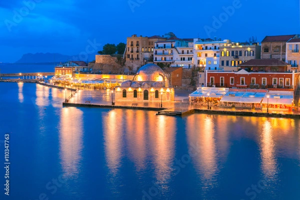 Fototapeta Picturesque panoramic view of Venetian quay of Chania with Kucuk Hasan Pasha Mosque during twilight blue hour, Crete, Greece