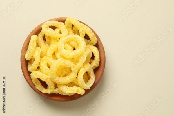 Obraz Corn ring crisps on color background, top view