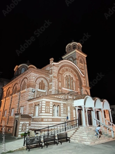 Fototapeta A beautiful church in Greece, showcasing classic Mediterranean architecture with whitewashed walls and blue accents. The serene setting reflects the charm and spirituality of the Greek landscape.