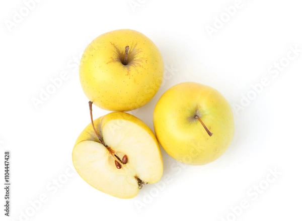 Fototapeta Whole and cut ripe yellow apples isolated on white, top view