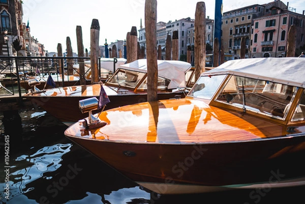 Obraz Elegant Venetian Water Taxis Moored at a Picturesque Dock in Venice's Historic Canal District