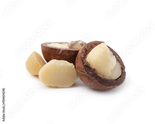 Fototapeta Macadamia nuts with shells isolated on white