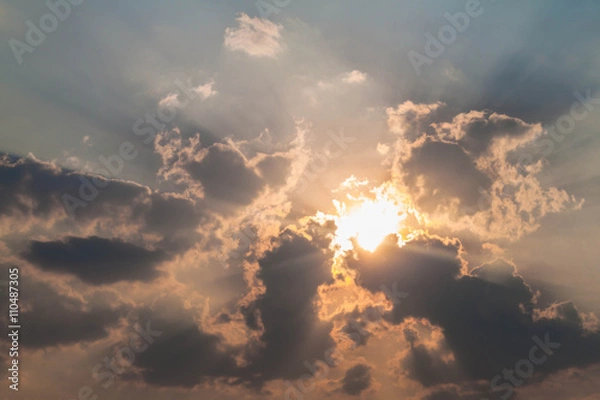 Fototapeta Sun shining through the clouds,Beautiful background