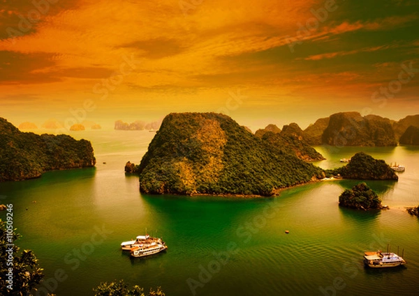 Fototapeta HALONG bay in sunset in vietnam. UNESCO World Heritage Site. This view from TiTop island and its most popular view for travel in Halong bay.
