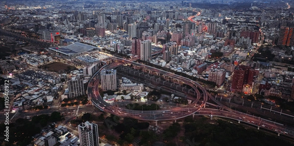Fototapeta Aerial view of Kaohsiung vibrant urban landscape at twilight with busy traffic